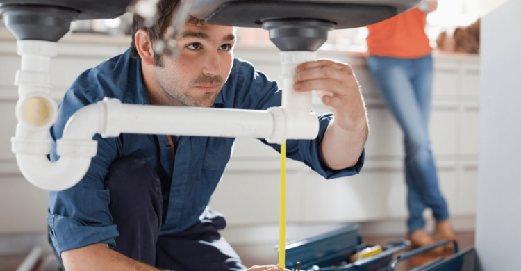 good plumber installing sink trap