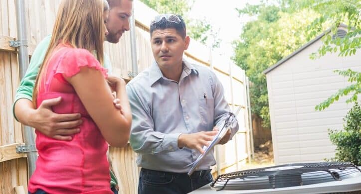 HVAC technician answering a homeowner's questions