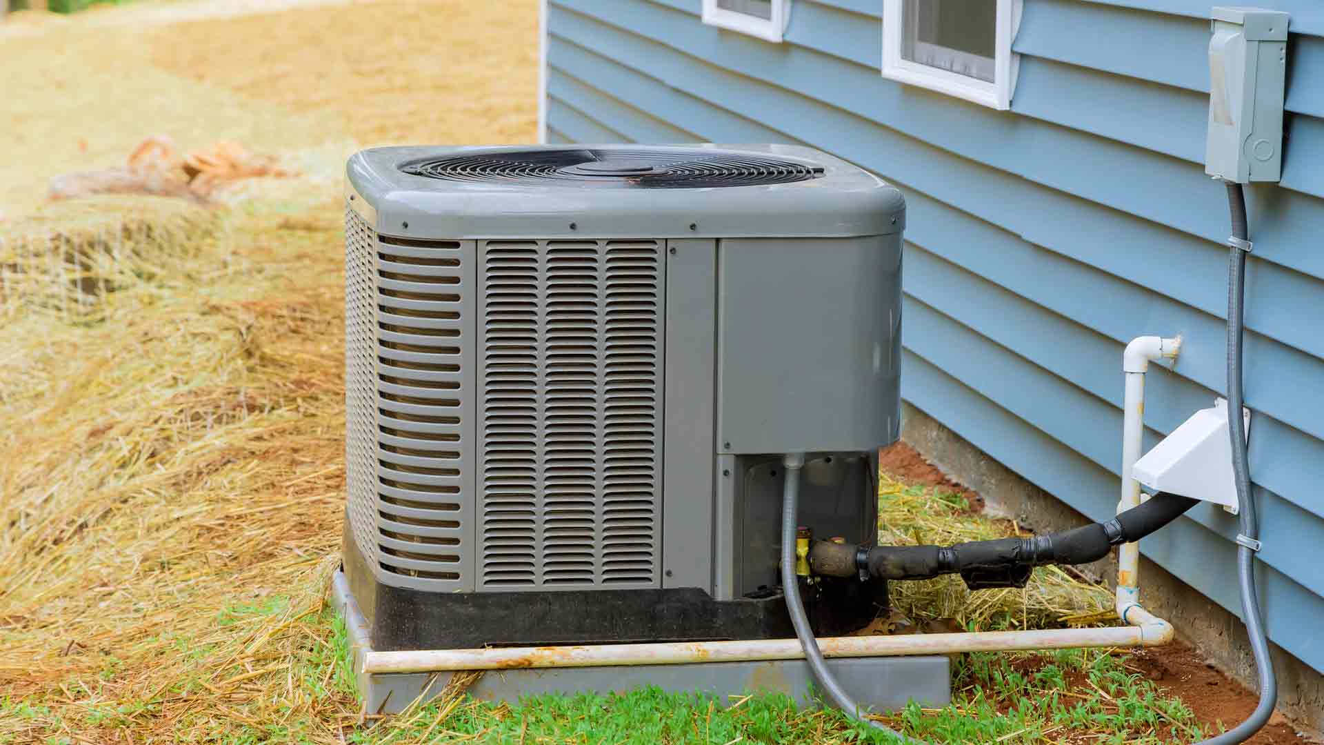 Residential HVAC system behind home